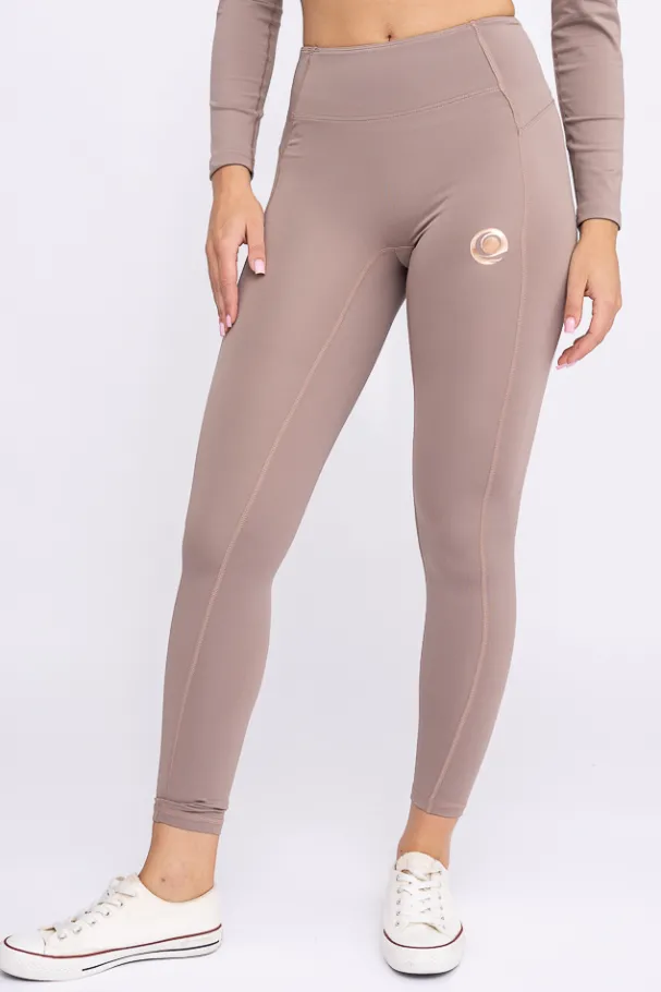 Ciemnobeżowe Legginsy sportowe SPINTI<Polski New
